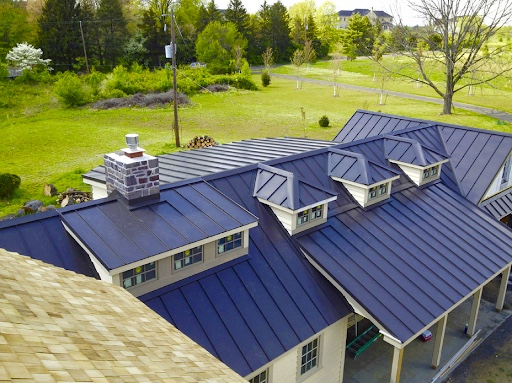 https://www.roofportland.com/wp-content/uploads/Standing-Seam-Metal-Roof-2.jpg