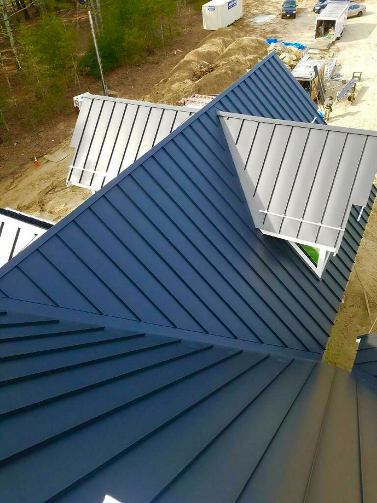 https://www.roofportland.com/wp-content/uploads/Standing-Seam-Metal-Roof-3.png